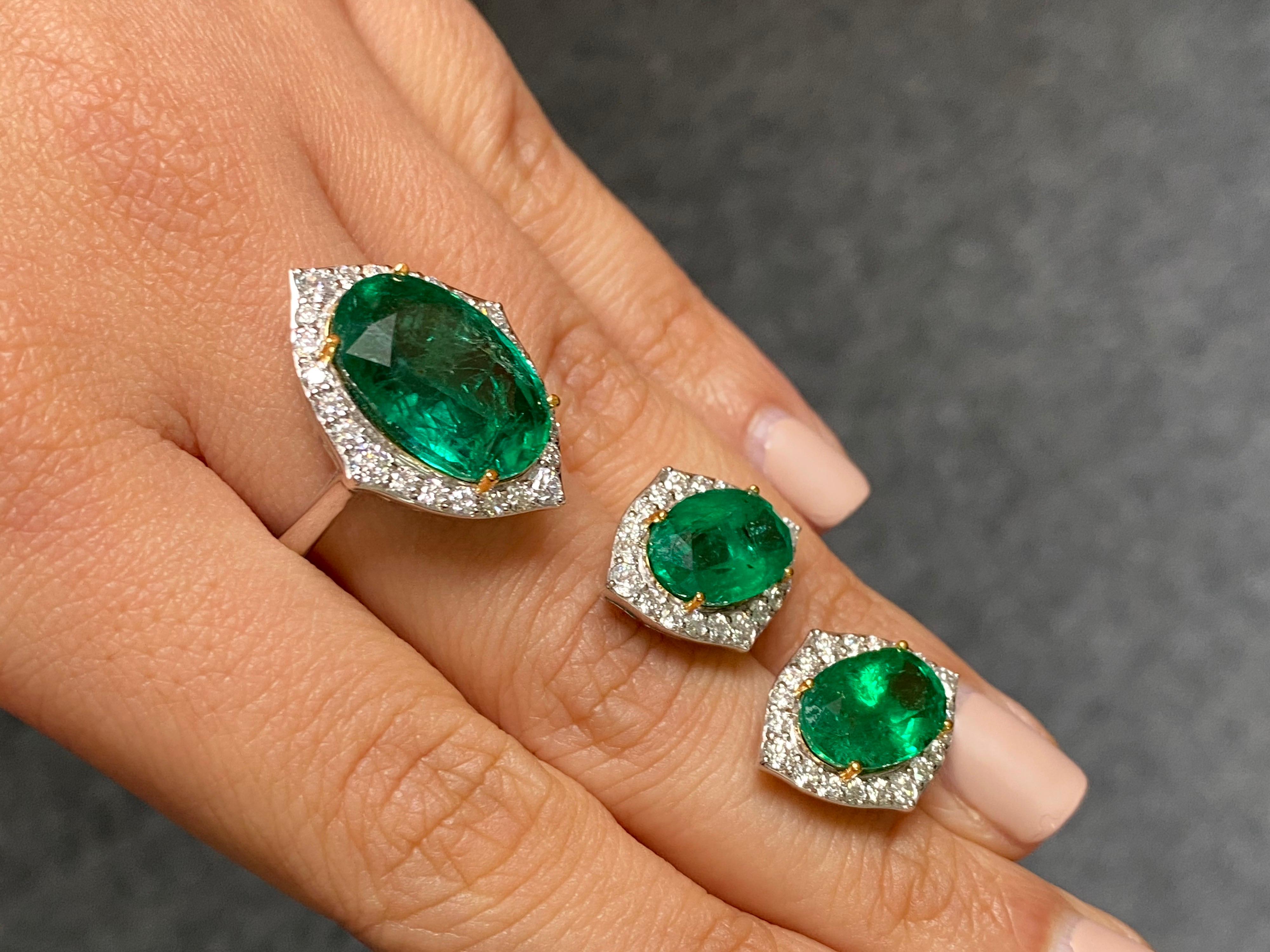 A stunning pair of 7.37 carats Zambian Emerald studs with 1.23 carats White Diamonds, and a matching cocktail ring with 8.52 carats oval Zambian Emerald and 0.82 carat colorless White Diamonds. The Emeralds are transparent with amazing luster and