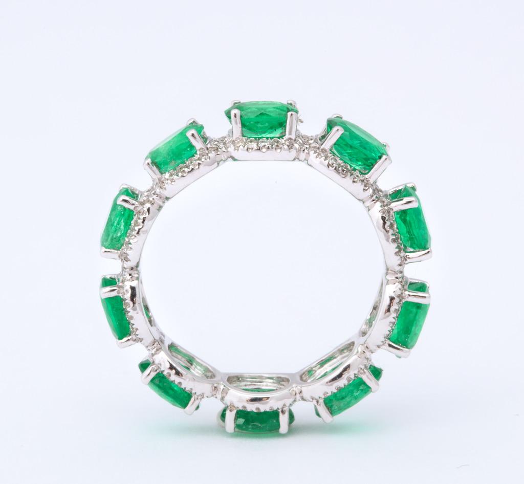 Oval Emerald and Diamond Halo Eternity Band Ring In New Condition In Bal Harbour, FL