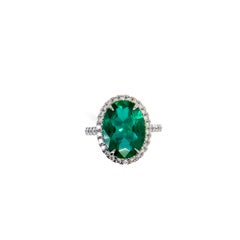 Oval Emerald and Diamond Halo Ring