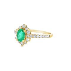 Oval Emerald and Diamond Halo Ring in 14K Yellow Gold 0.88ct Total