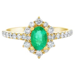Ovaler Smaragd und Diamant Halo Ring in 14K Gelbgold 0,88ct Total