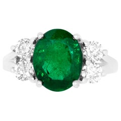 Oval Emerald and Diamond Side Stone Engagement Ring Oval Emerald and Diamond Side Stone Engagement Ring