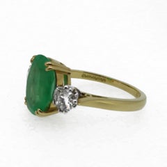 Oval Emerald and Diamond Three-Stone Ring 18 Karat Yellow and White Gold