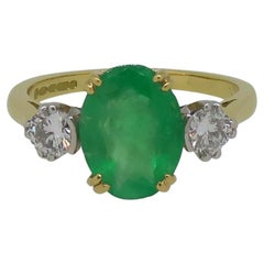 Oval Emerald and Diamond Three-Stone Ring 18 Karat Yellow and White Gold