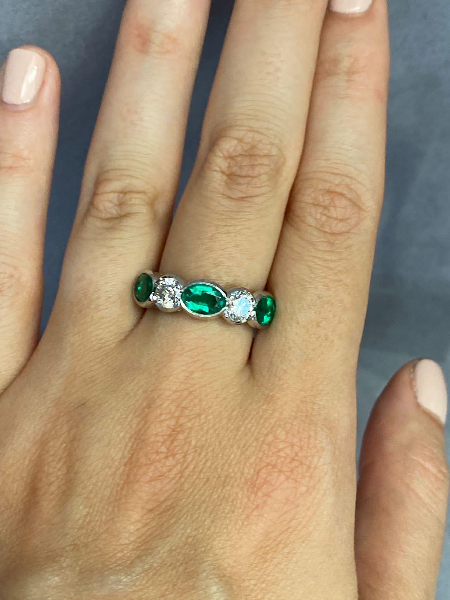 Oval Cut Oval Emerald and Round Diamond Five Stone Platinum Ring For Sale