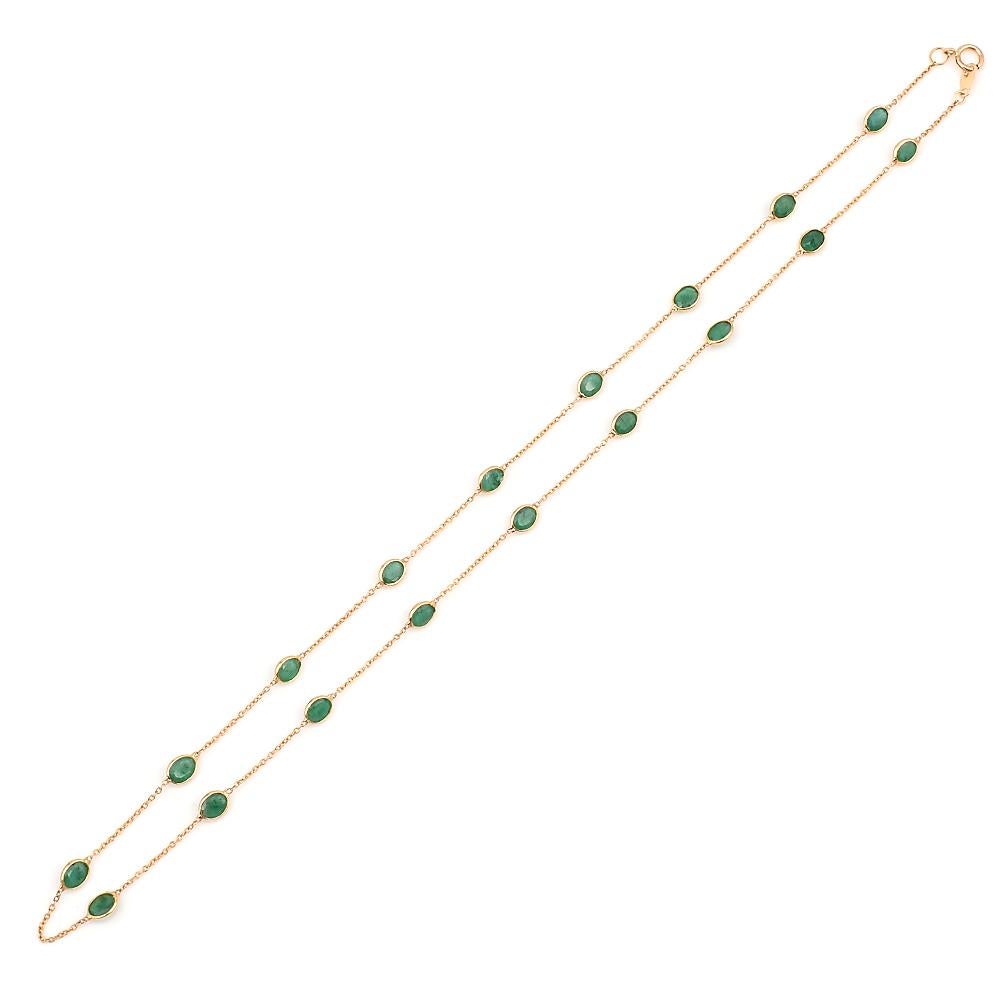 An Oval Emerald Bezel-Set Necklace made in 18 Karat Yellow Gold. 
The length of the necklace is 17.75