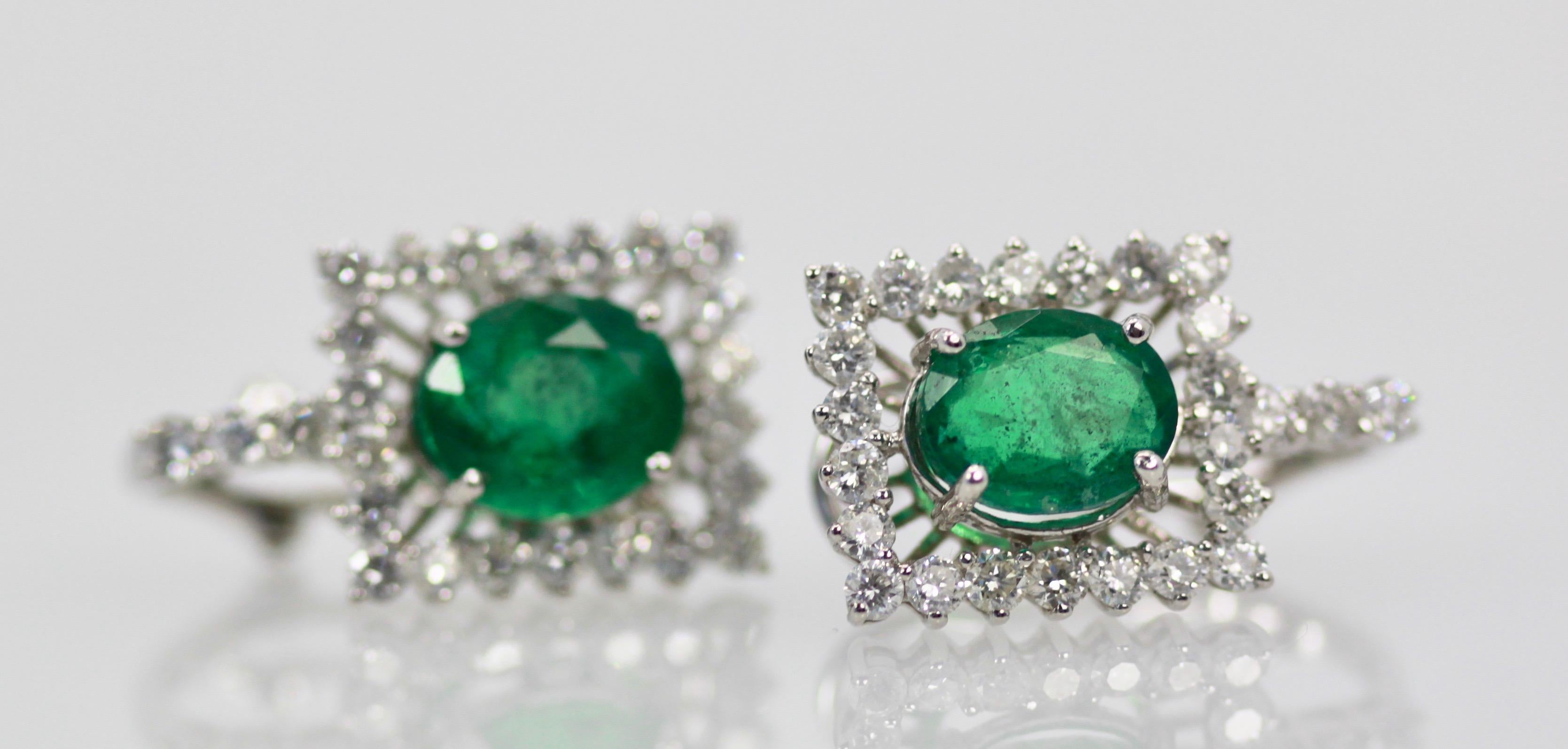 These gorgeous handmade earrings features two genuine earth mined untreated oval cut emeralds of approximately 5.83 carats. These emeralds has a lovely color of green and unaided by magnification is clean and transparent to the naked eye.