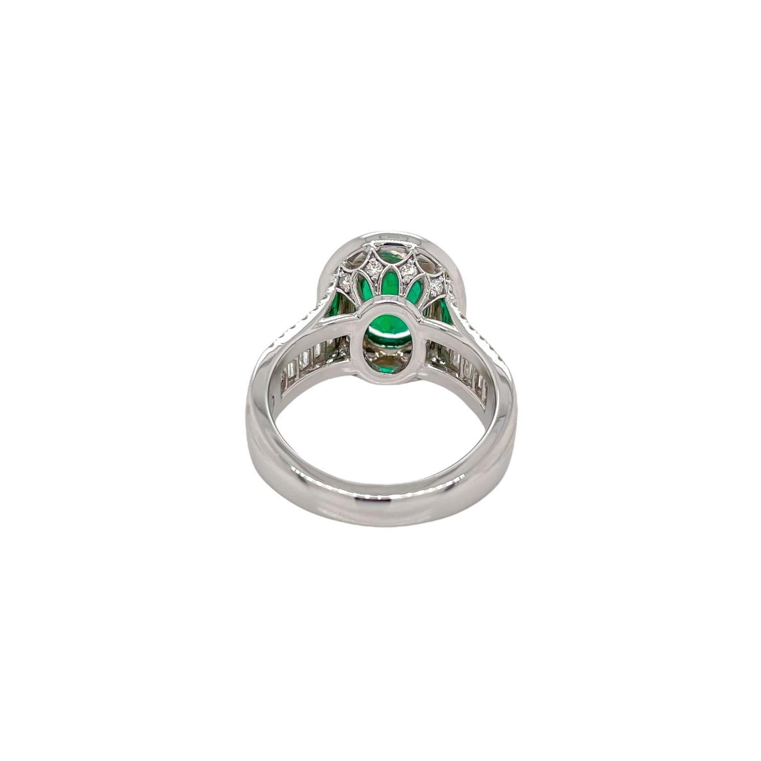 Oval Cut Oval Emerald & Diamond Halo Ring in 18K White Gold For Sale