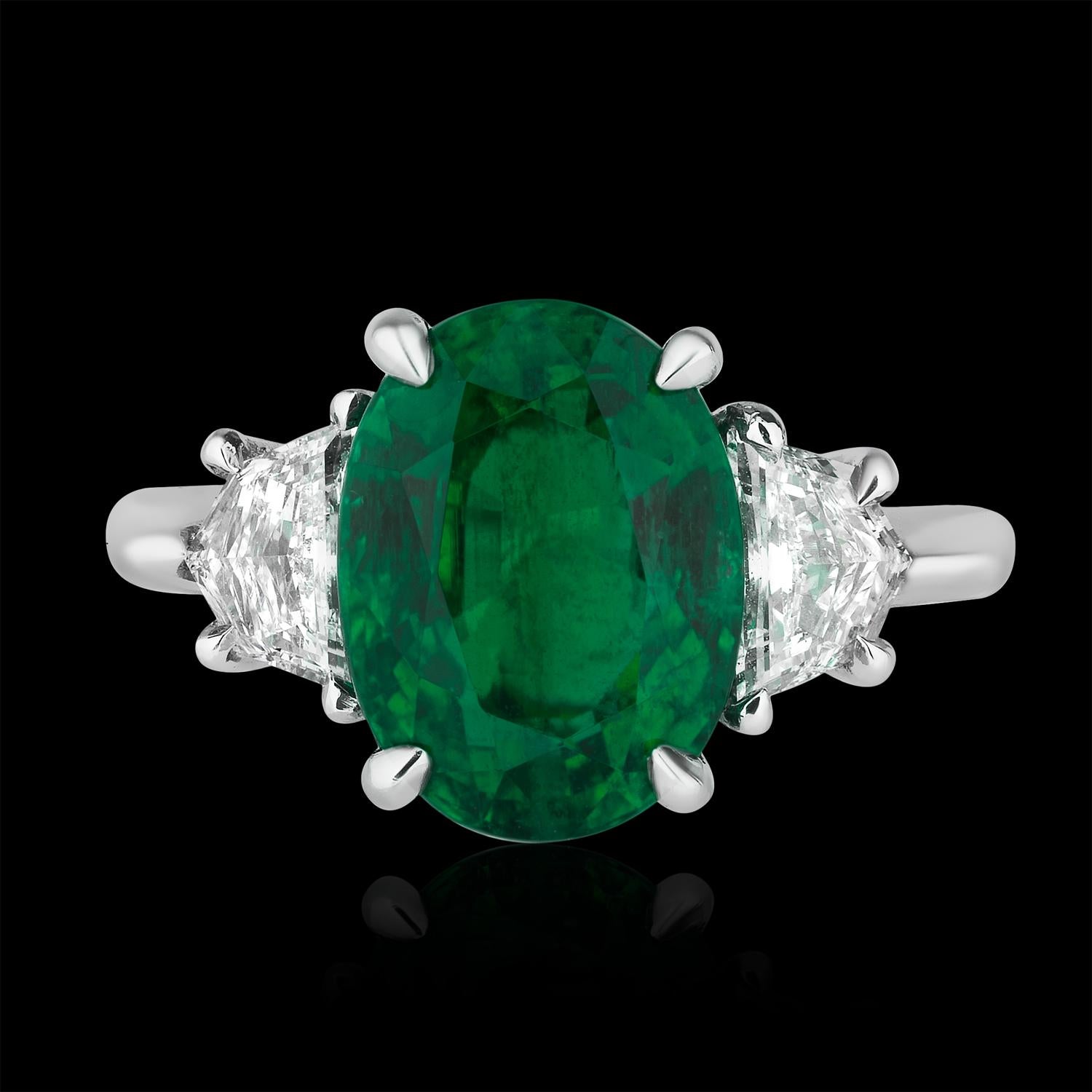 diamond ring with emerald side stones