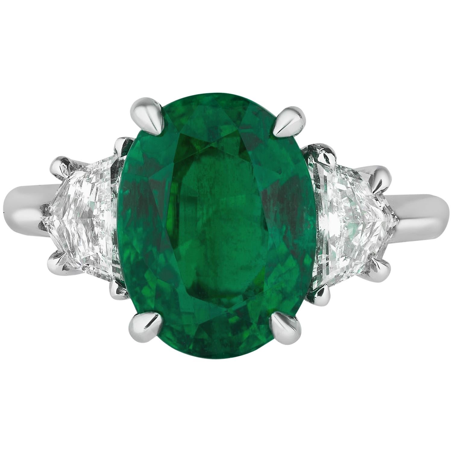 Oval Emerald Engagement Ring with Diamond Side Stones Platinum Andreoli For Sale