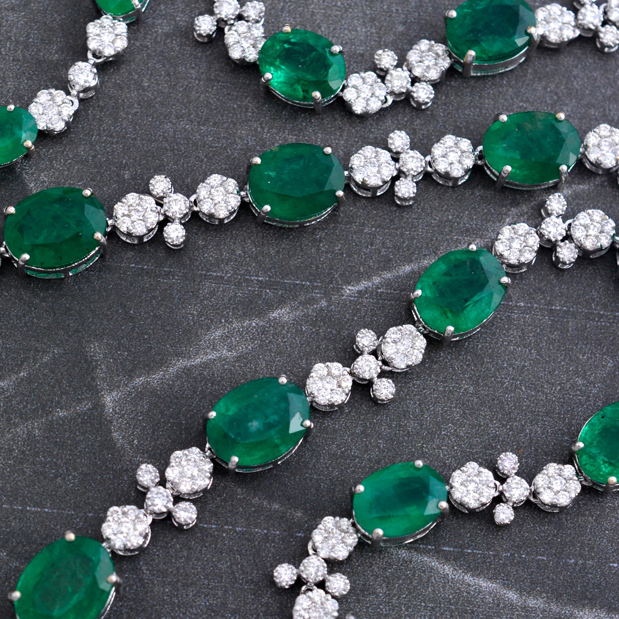 The necklace is meticulously handcrafted from 14 karat white gold, chosen for its luxurious appearance and durability. The white gold setting perfectly complements the emerald and diamonds, creating a harmonious blend of elegance and strength. The