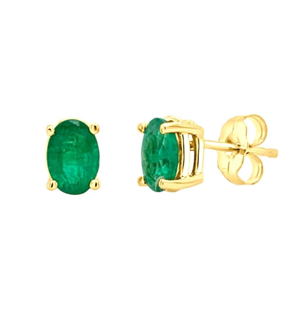 Elevate your elegance with our exquisite Oval Emerald Gemstone Stud Earrings, available in sizes ranging from 0.70 to 0.80 carats. Set in luxurious 14K yellow gold, these earrings showcase captivating emeralds with their deep green allure. Add a
