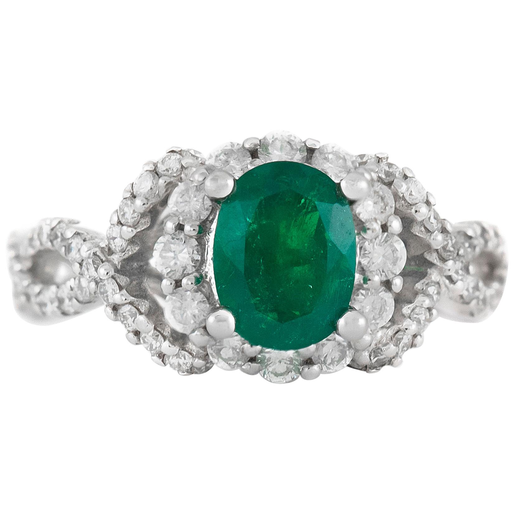 Oval Emerald on 18 Karat White Gold Setting with Diamonds Ring