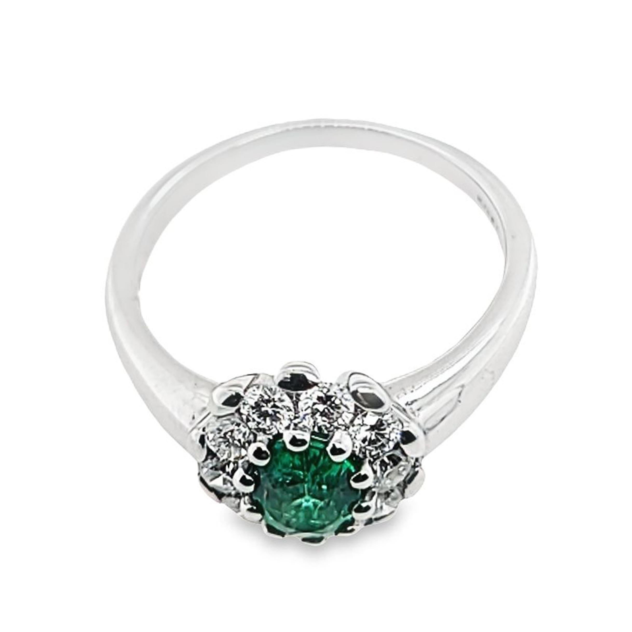 Oval Emerald Ring with Diamond Halo In Good Condition For Sale In Coral Gables, FL