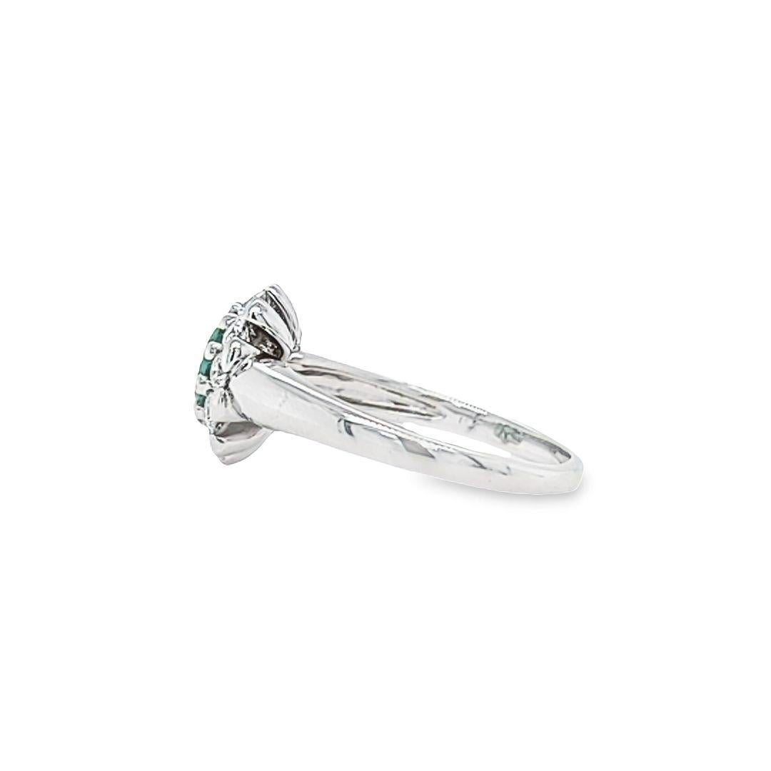 Women's Oval Emerald Ring with Diamond Halo For Sale
