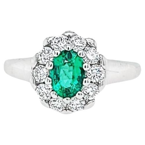 Oval Emerald Ring with Diamond Halo For Sale