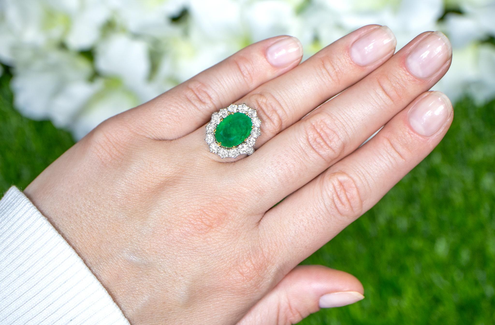 Oval Cut Oval Emerald Ring With Diamond Halo Setting 6.24 Carats 18K Gold For Sale