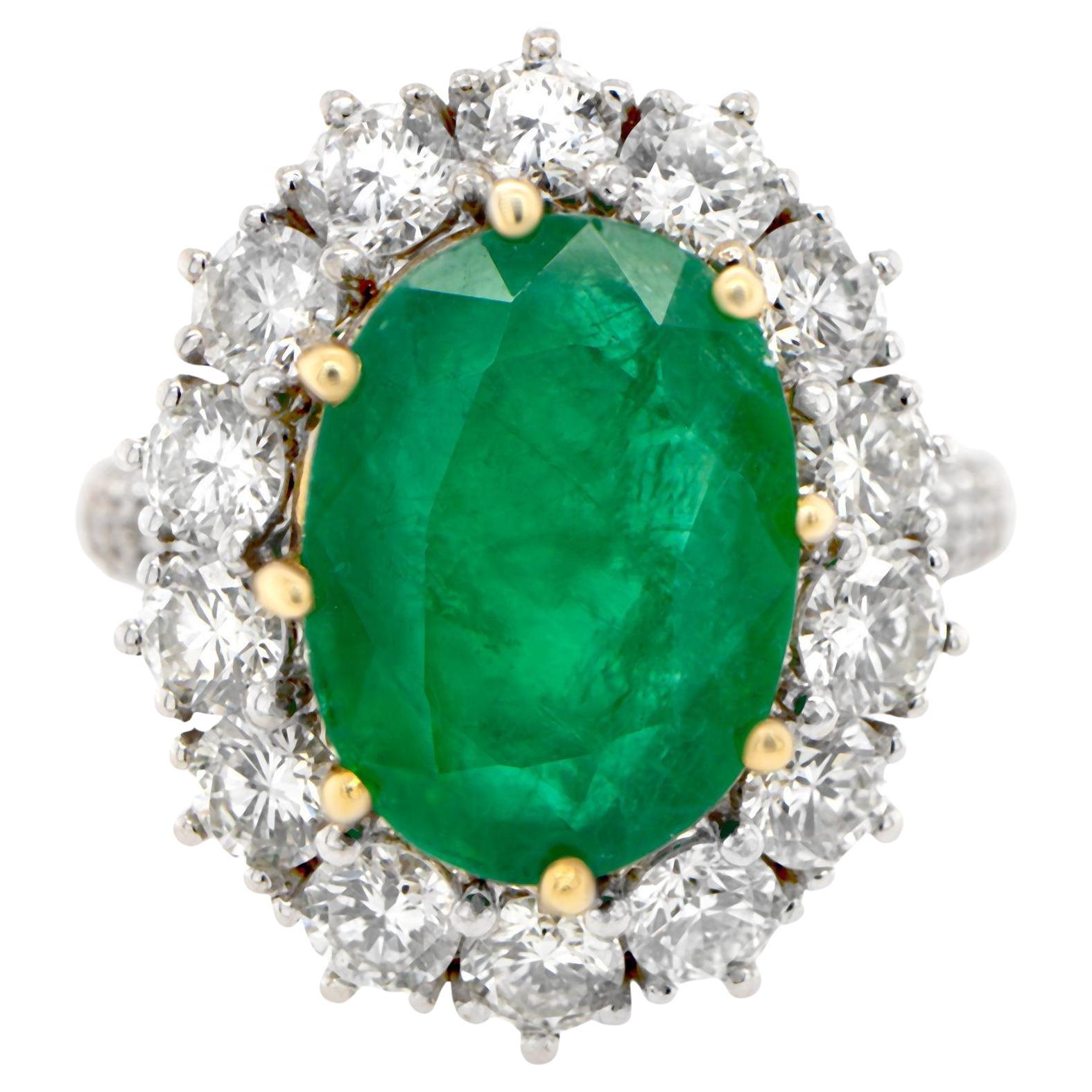 Oval Emerald Ring With Diamond Halo Setting 6.24 Carats 18K Gold For Sale