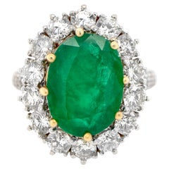 Oval Emerald Ring With Diamond Halo Setting 6.24 Carats 18K Gold