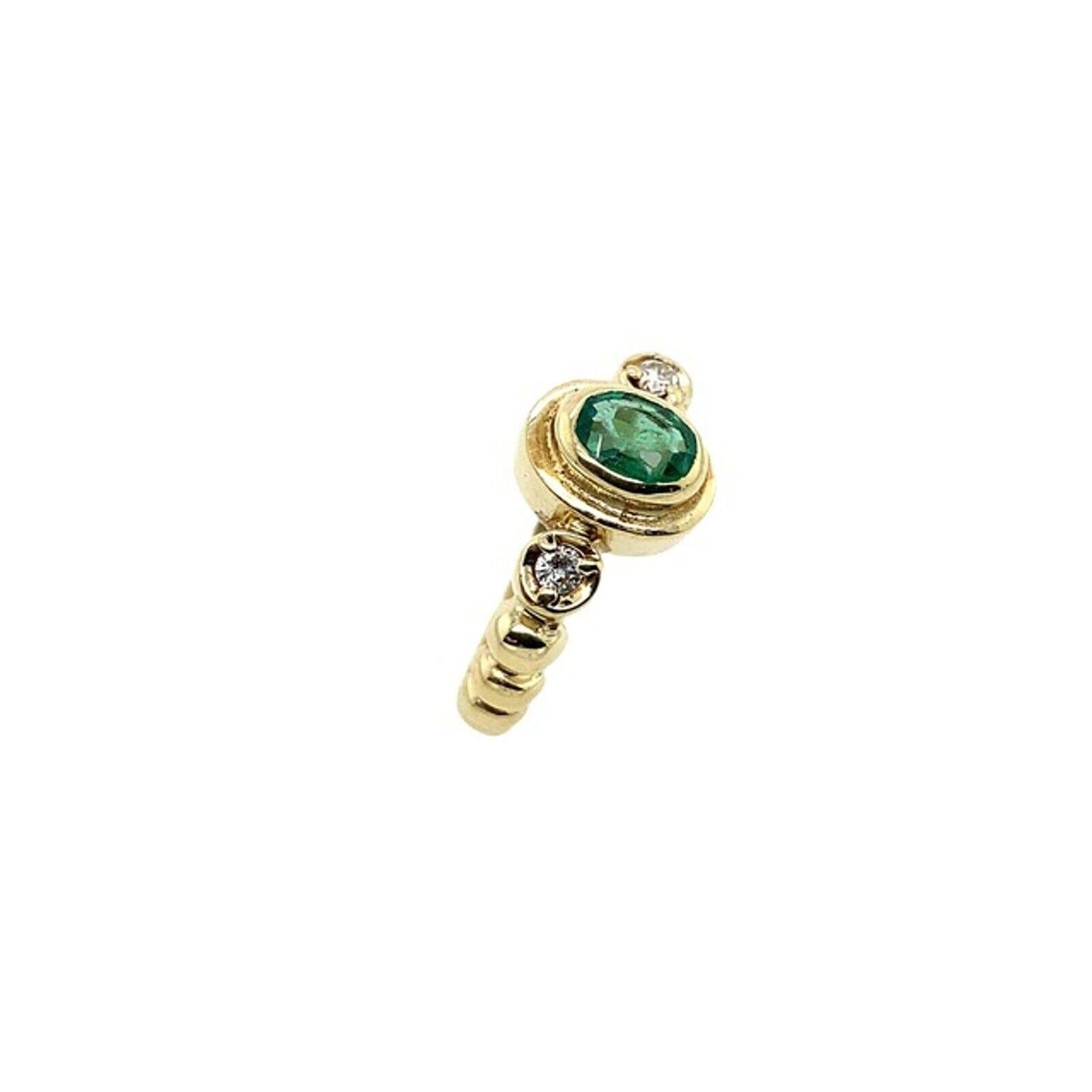 This gorgeous 0.50ct oval emerald ring set in 14ct yellow gold setting with 2 natural round brilliant cut diamonds on shoulders, 0.10ct. This is a unique and eye-catching ring.

Additional Information:
Total Diamond Weight: 0.10ct
Diamond Colour: