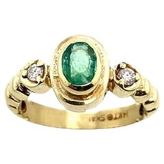 Oval Emerald & Round Diamonds 3-Stone Ring Set in 14ct Yellow Gold