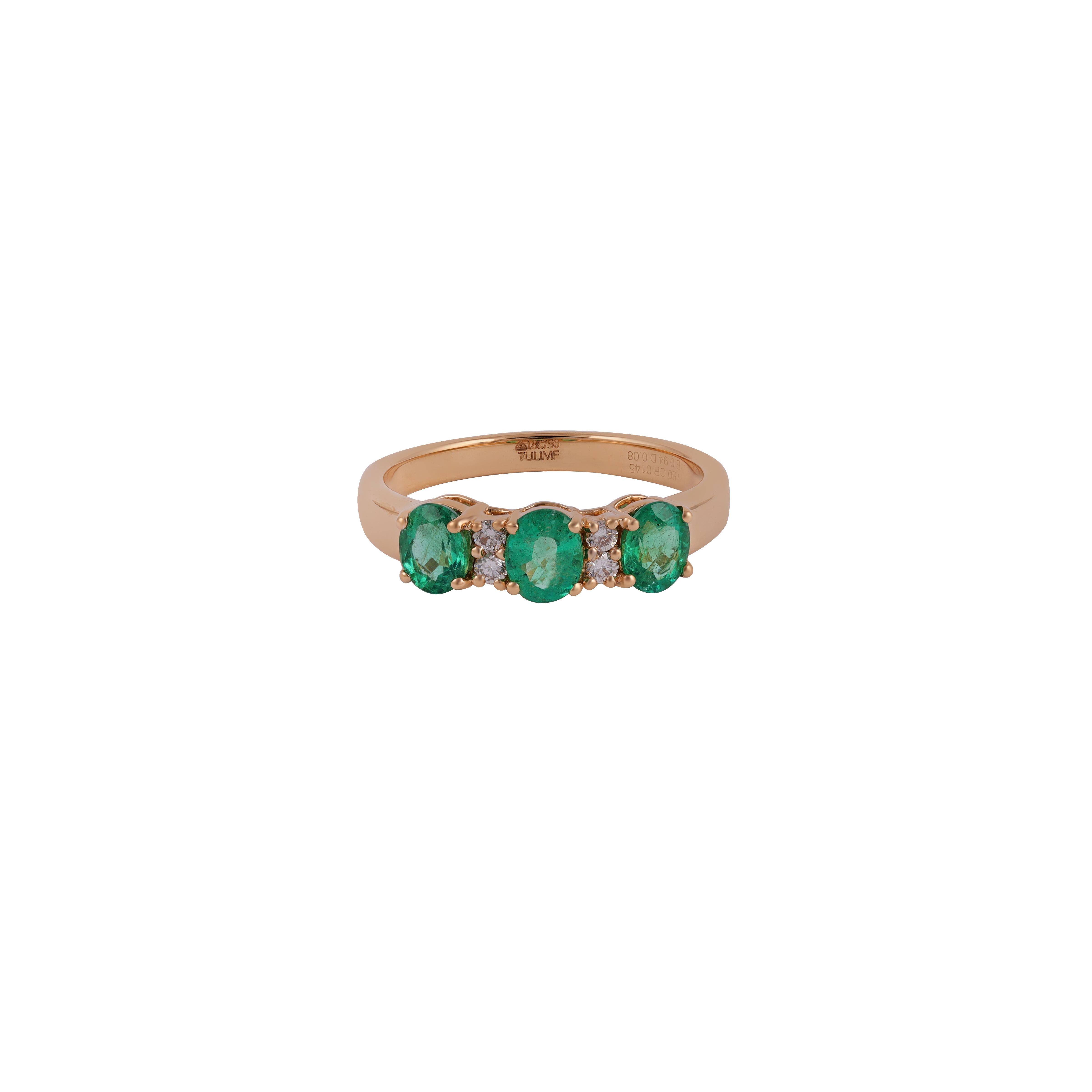 New Inspired Magnificent Emerald 3-Stone Ring 18 Karat Gold
The 3 Fine emeralds show excellent clarity, and excellent color, weighing Emerald  0.94 carats total, Diamonds 0.08 Carat & Gold 3.29 gm. The yellow gold Half band and setting add warmth
