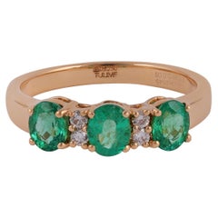 Oval Emeralds 0.94 Carat & Diamonds Ring Set in 18k Yellow Gold