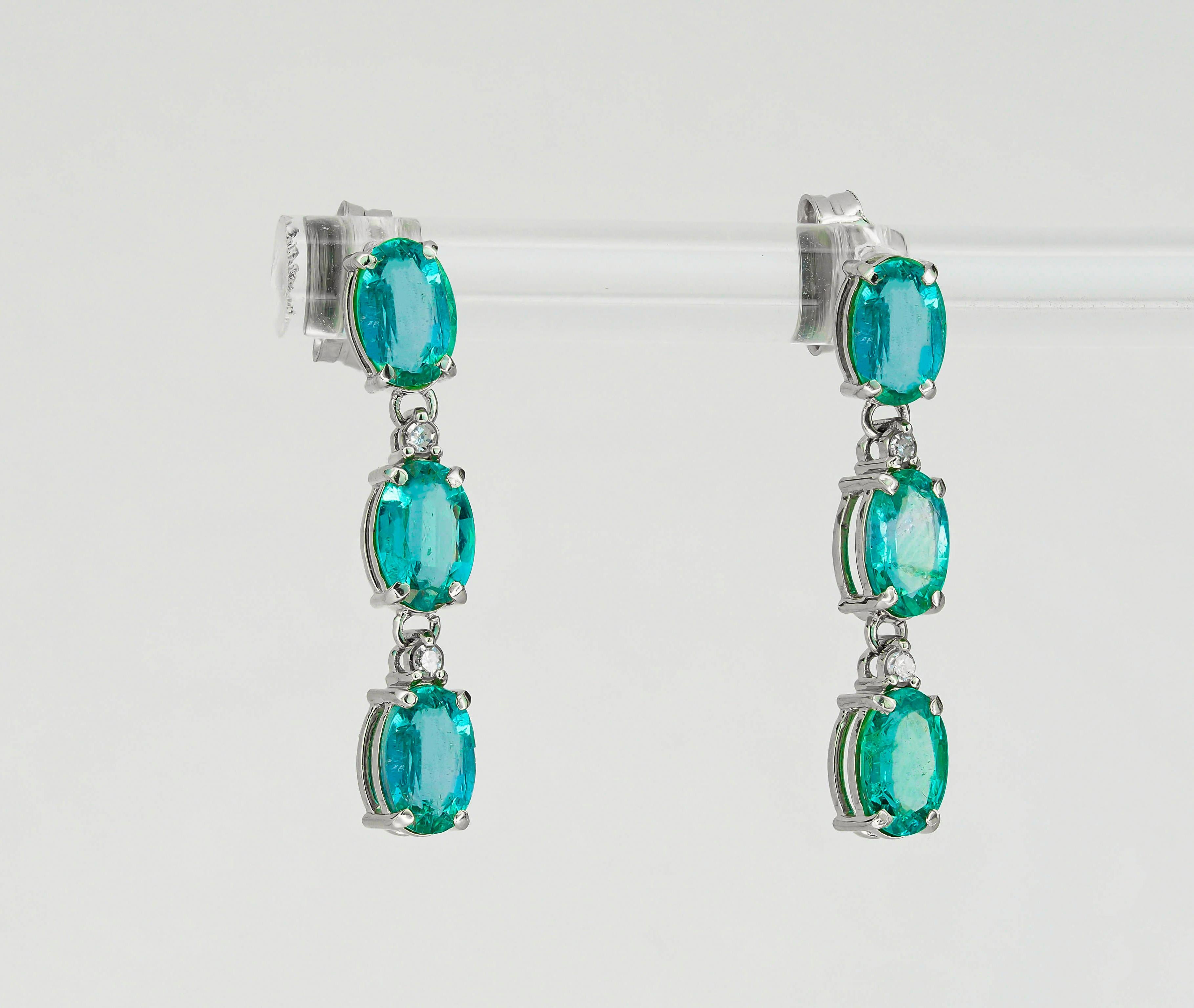 Modern Oval emeralds 14k gold earrings studs.  For Sale