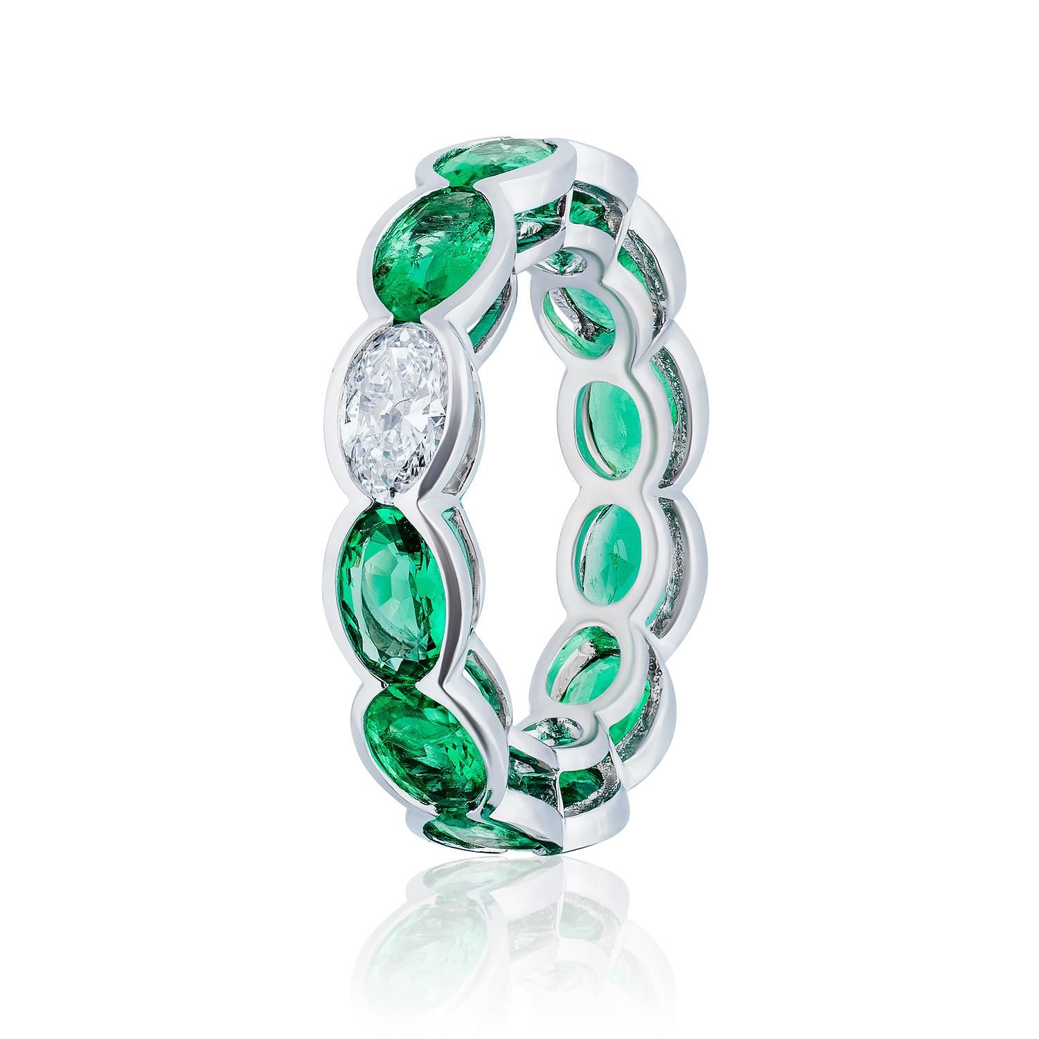 Semi Bezel Set Oval Gemstones

11 Emeralds weighing 4.73 Carats
1 Oval Diamond weighing 0.41 Carats
Set in Platinum.

Also available in Sapphires and Rubies.