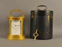 Oval Engraved Bell Striking Carriage Clock with Case
