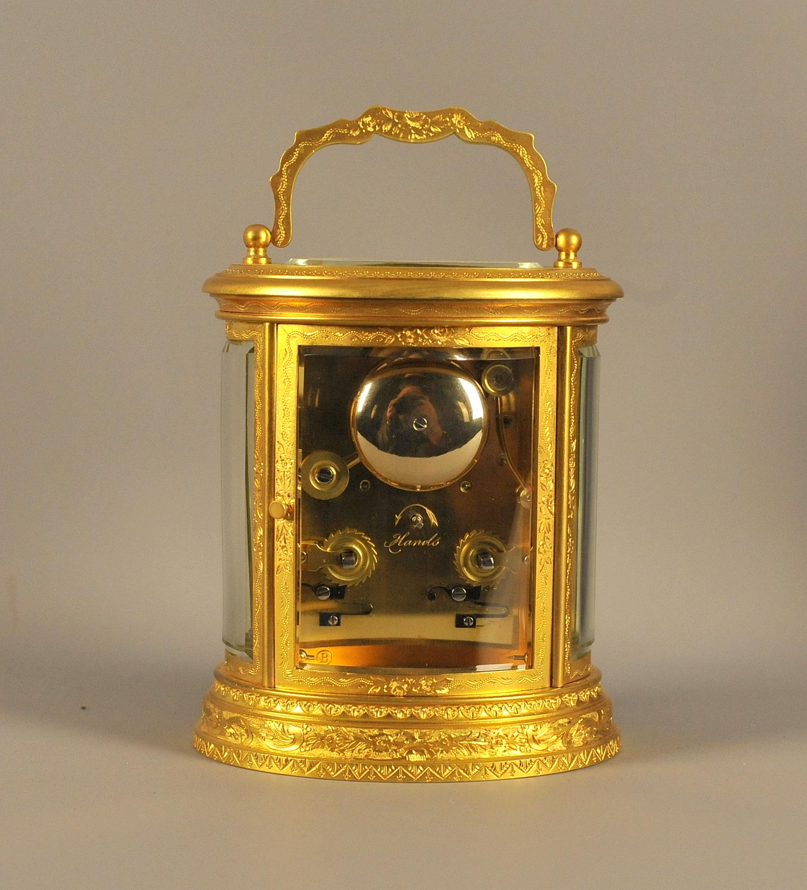 Oval Engraved Bell Striking Carriage Clock with Case In Good Condition For Sale In Chesterfield, GB