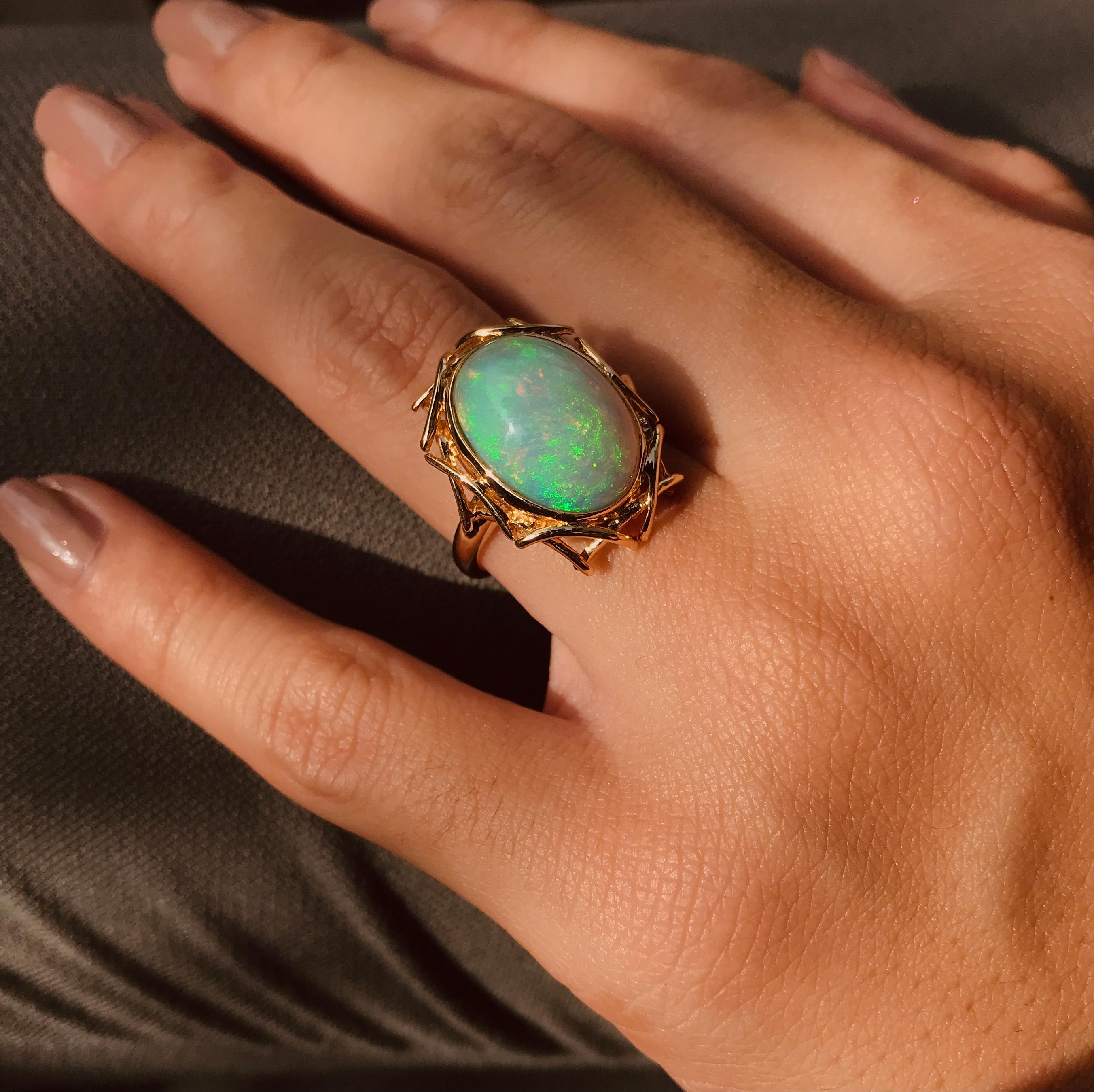 Delicate lines are wound in an oval motion to create elegant yet contemporary bird’s nest design. The Ethiopian Opal represents an egg in the nest, all set in 18k yellow gold. 

Ring Information
Metal: 18K Yellow Gold
Total weight: 8.48 g. (approx.