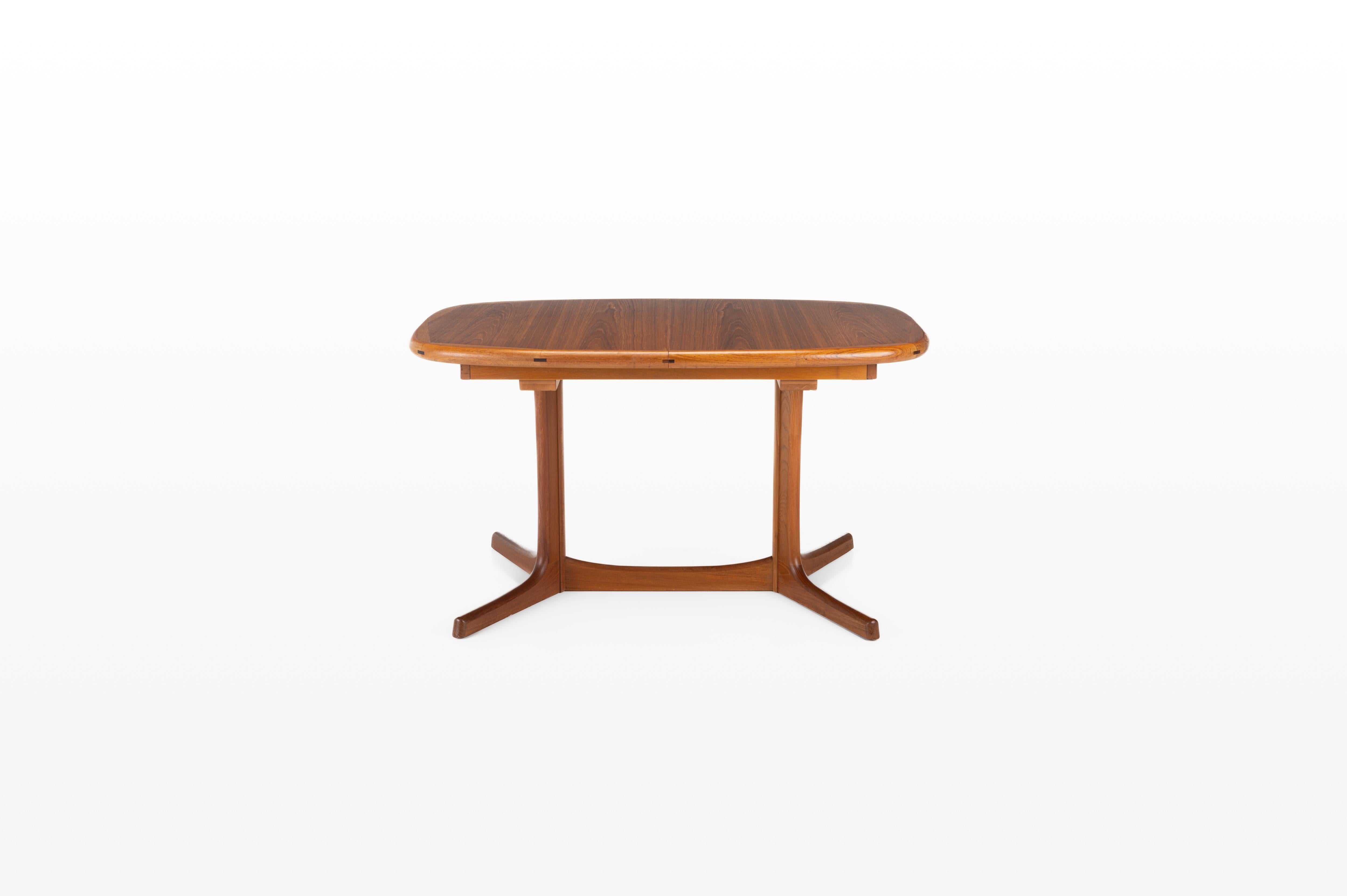 Beautiful extendable dining table produced by Dyrlund, Denmark. The table is made of teak wood and is in very good restored condition. Marked by the producer.
