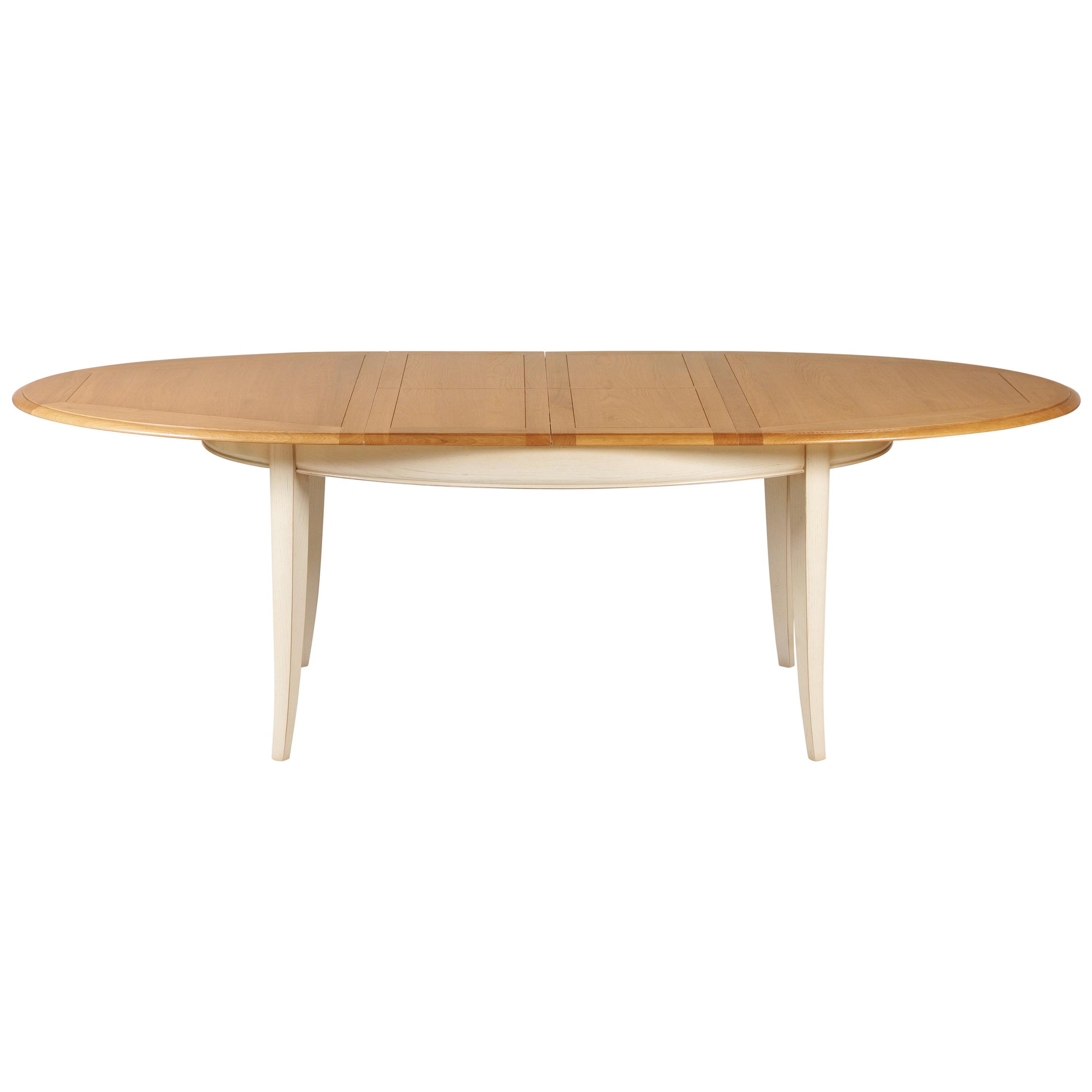 This oval dining table is in a French Countryside style also called 