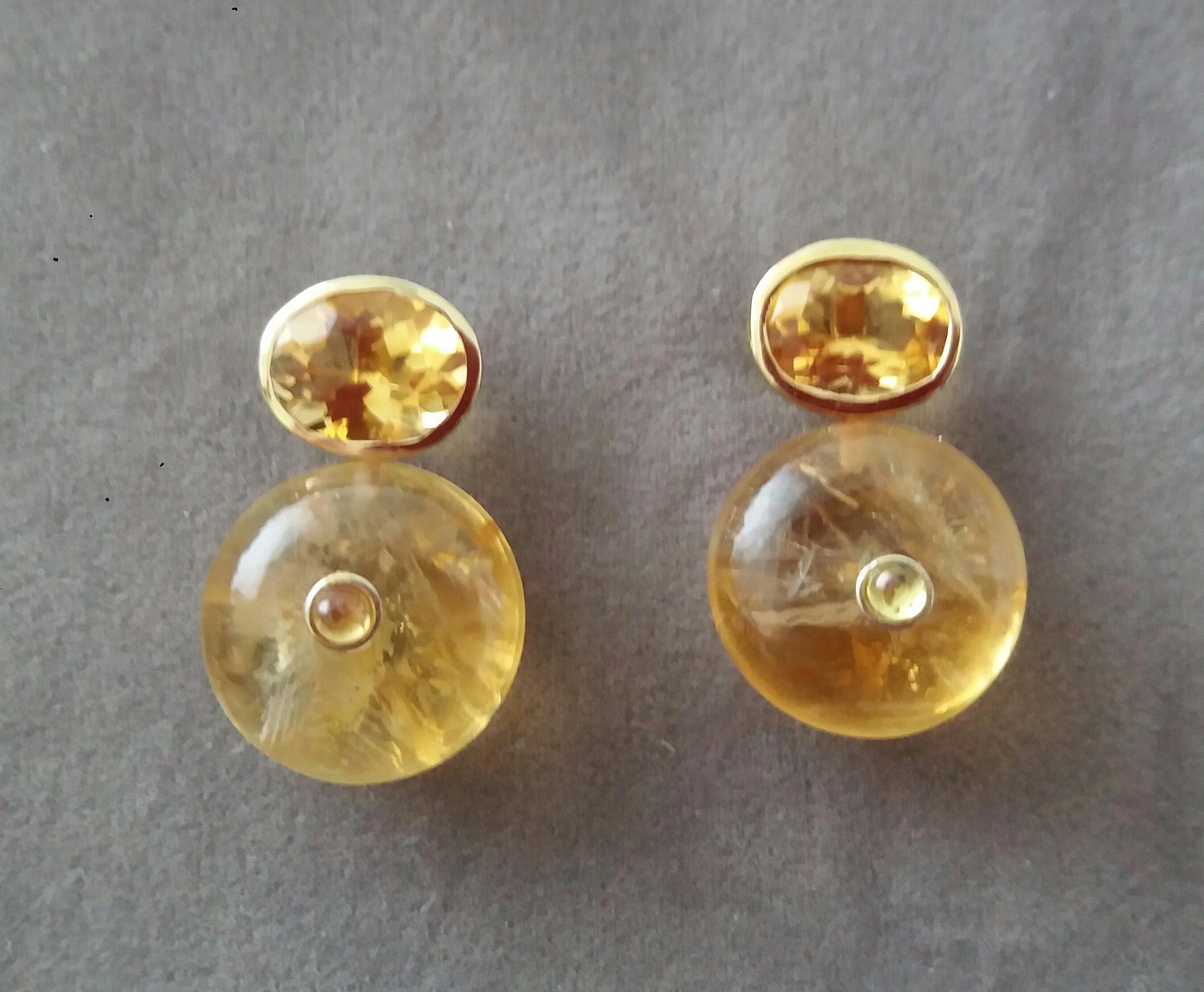 Simple chic stud earrings with a pair of Oval Cut Citrine measuring 8mm x10 mm set in solid 14 Kt. yellow gold on the top and in the lower parts 2 Round Plain Wheel Shape Citrine  16 mm .in diameter with a small round Yellow Sapphire cab in the