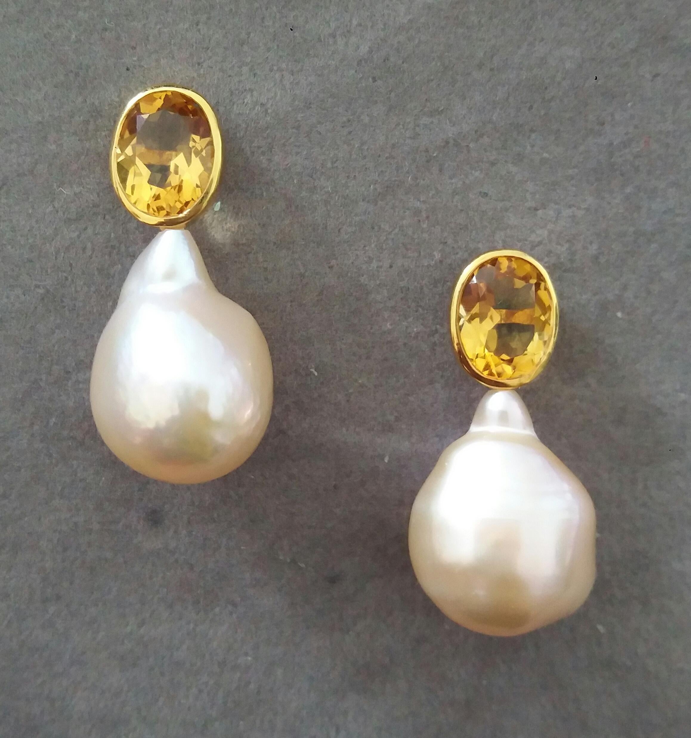 These simple but elegant and completely handmade earrings have 2 Oval Faceted  Natural Cognac Color Citrines measuring 7 x 9 mm set in yellow gold bezel at the top to which are suspended 2  Pear Shape Baroque Cream Pearls measuring 14x17 mm.

In