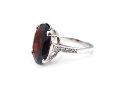 Oval Faceted Garnet and Diamond Ring
