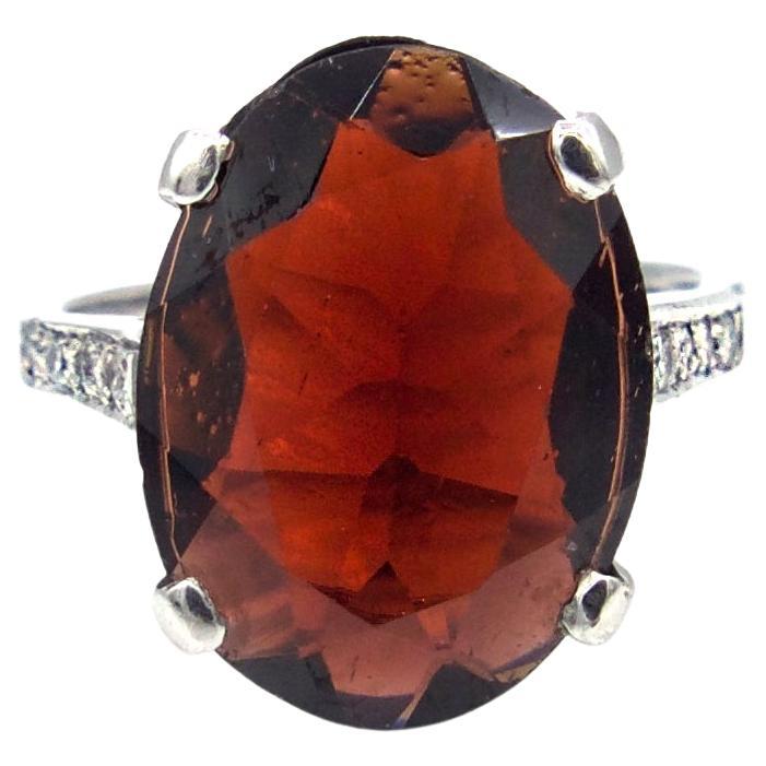 Oval Faceted Garnet and Diamond Ring For Sale