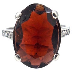 Oval Faceted Garnet and Diamond Ring