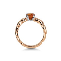 Oval Faceted Orange Spessartite Garnet in 18 Karat Rose Gold Carved Band