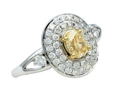 Oval Cut Fancy Yellow Diamond and Pavé Diamond Double Halo Ring 14 Karat Gold