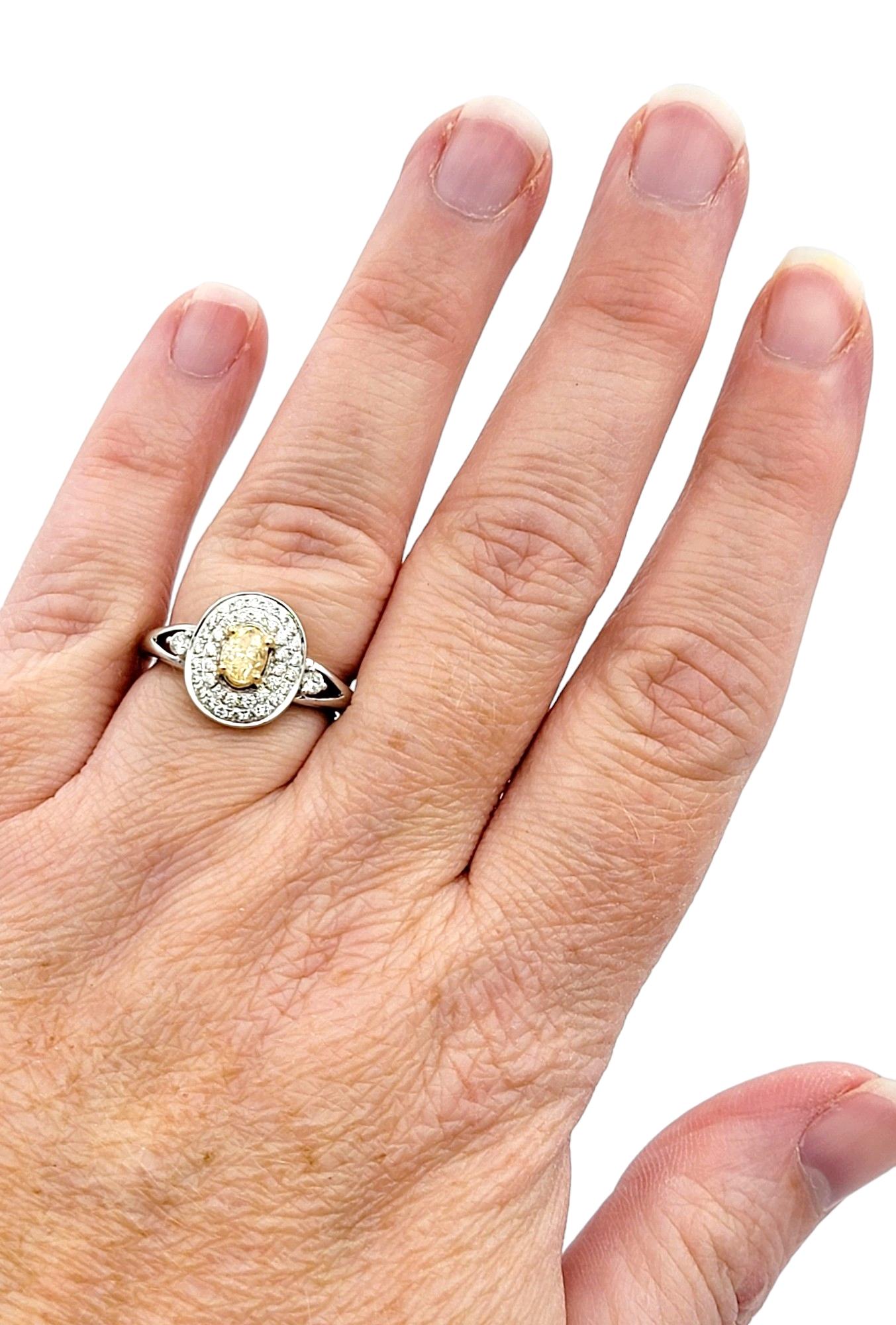 Women's Oval Fancy Yellow Diamond with White Diamond Double Halo Set in White Gold For Sale