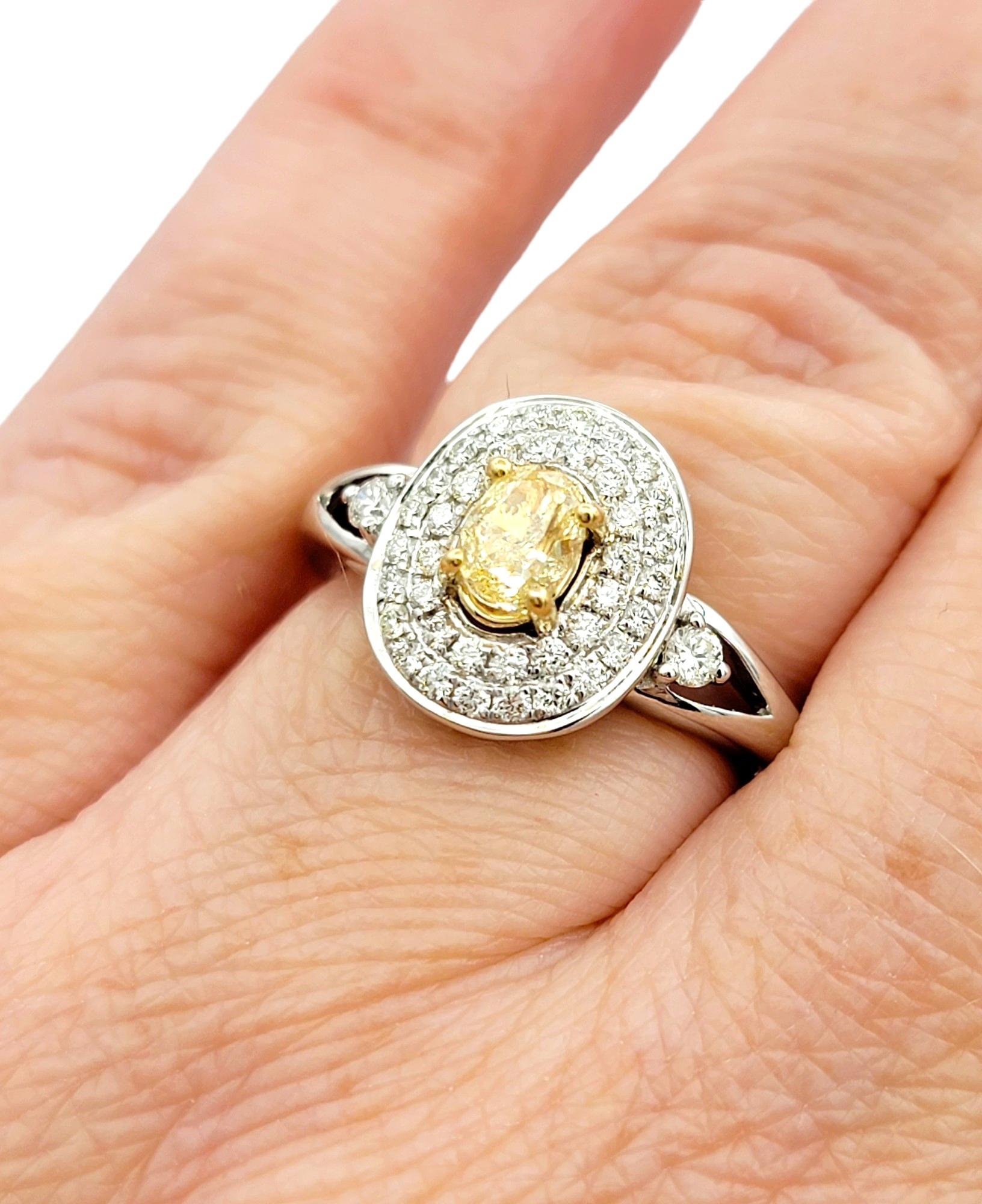 Oval Fancy Yellow Diamond with White Diamond Double Halo Set in White Gold For Sale 1