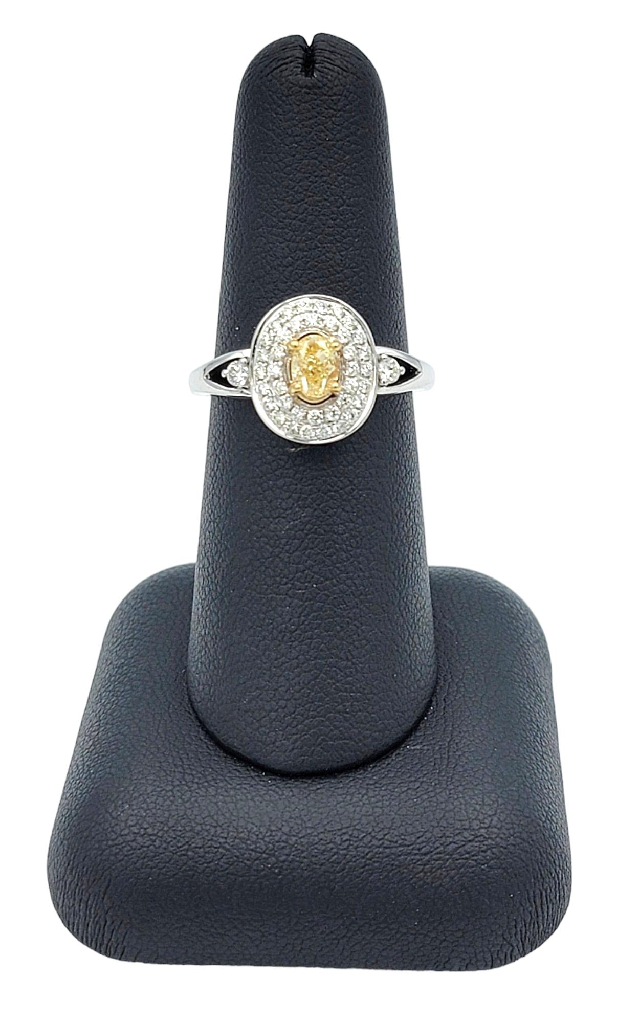 Oval Fancy Yellow Diamond with White Diamond Double Halo Set in White Gold For Sale 2