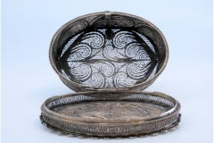 Oval filigree silver jewelry box on four feet with hinged lid