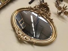 Oval Florentine Antique Mirror with a Gilt Frame