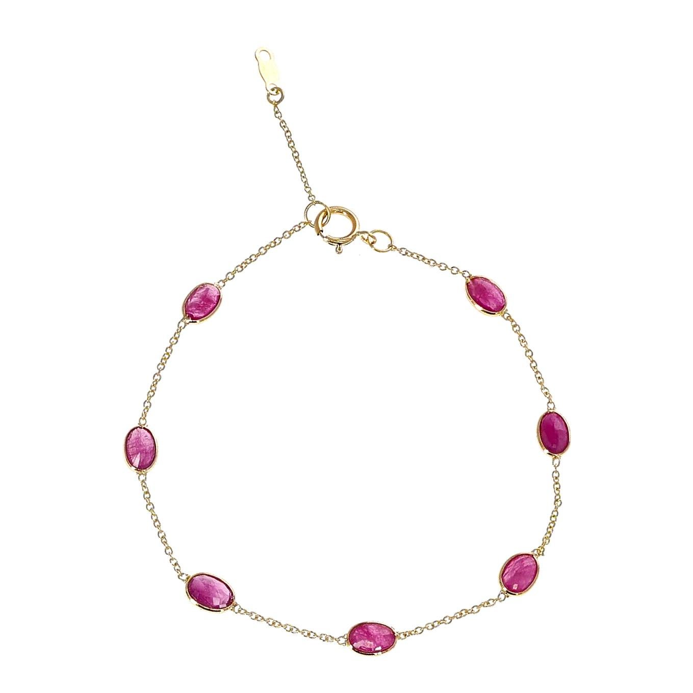 A 4 x 6MM Oval Genuine Ruby 18k Yellow Gold Adjustable Bracelet. The length of the bracelet is 7.50.