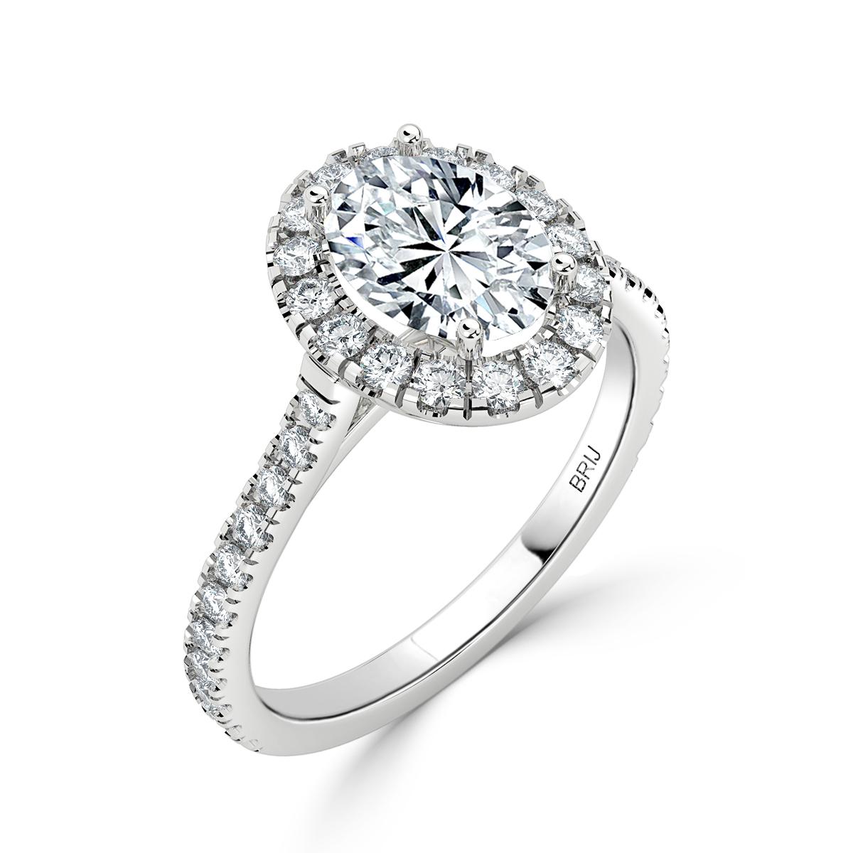 Simple, classic Diamond Halo engagement ring. Accented with 28 full cut diamonds along the shank  and Halo in a 18k White Gold setting. 
GIA certified round center stone 0.70 CT
Total Carat weight above 1.20 CT

GIA Certified Diamond Details
Weight: