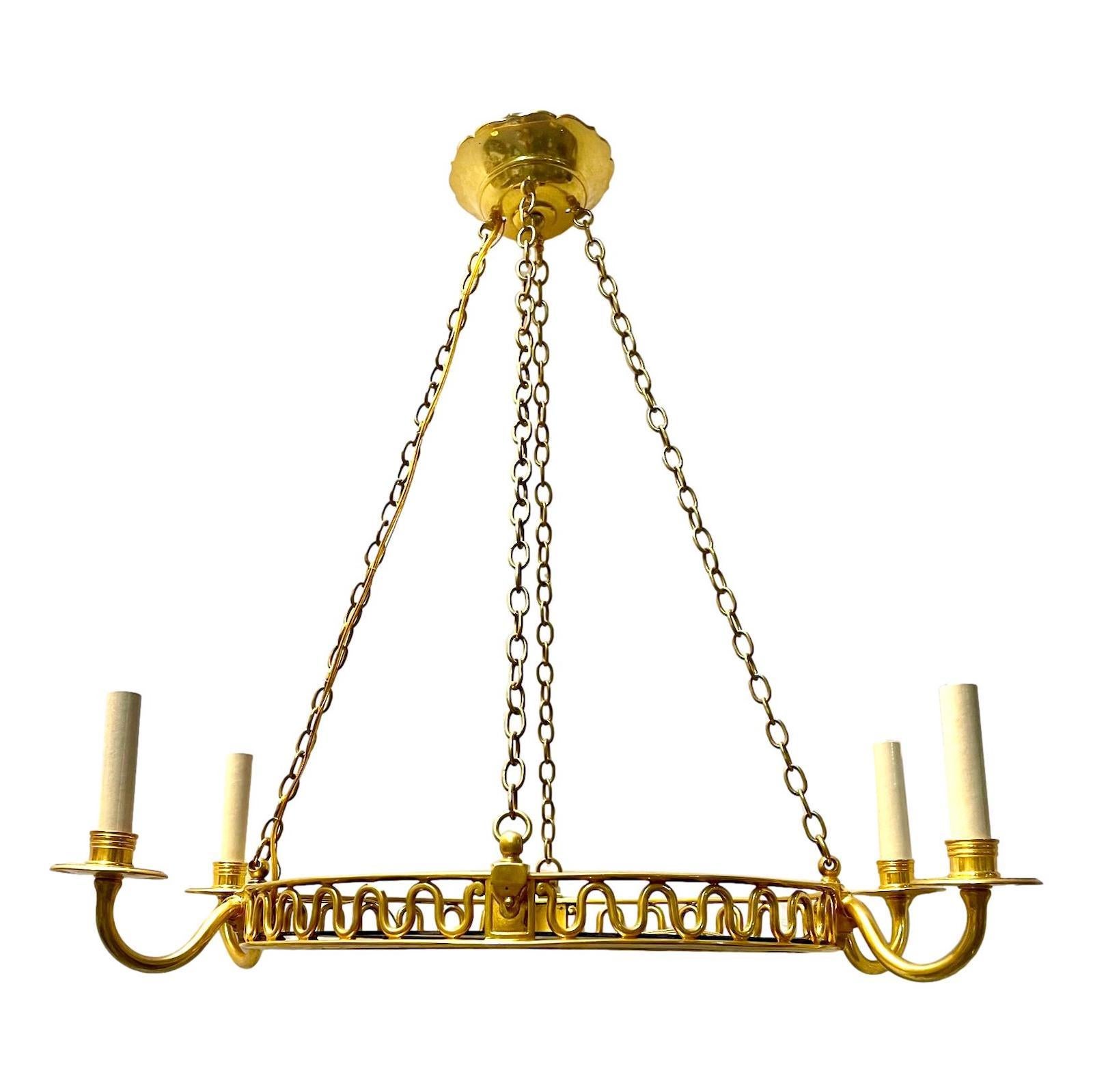 A circa 1950's French gilt chandelier with cobalt blue glass inset.

Measurements:
Drop: 28