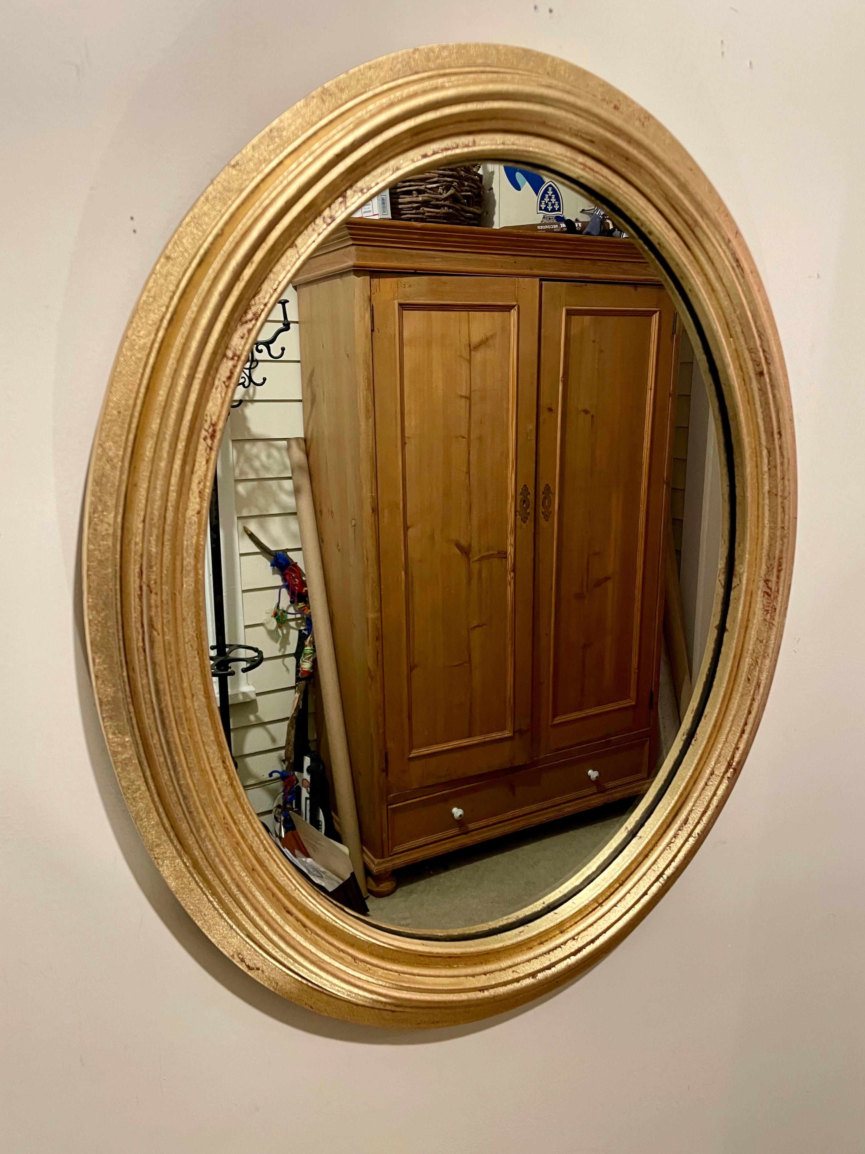 Italian gilt wood oval mirror. Great size, Measures 24